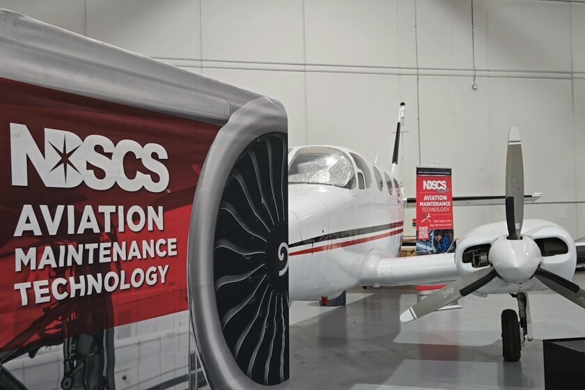 Airplane and NDSCS sign
