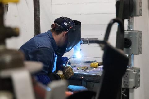 Student welding during contest