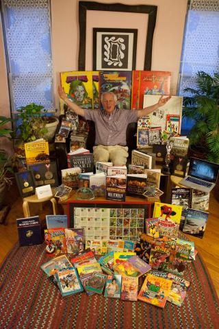 Dwight Zimmerman surrounded by many of his works